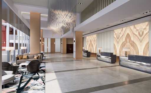Spacious and elegant lobby of Jamul Casino Hotel with modern decor, luxurious seating, and a grand chandelier.